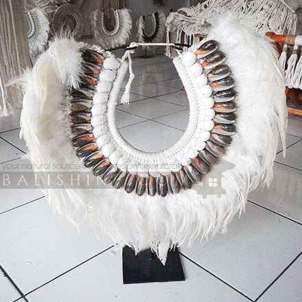 Balishine: Your natural source of indonesian handicraft presents in its Home Decor collection the Padang Tribal Necklace Feather Shell Decorative on Stand:12NUS878003:For ancient Indonesians, jewelry as such was an essential part of ceremonial dress.  Jewelry could be worn as a symbol of power and standing or to protect the wearer from spiritual harm. The shell and feather necklace makes for a spectacular eye-catching home decor piece.  Each necklace is one-of-a-kind and will no doubt make a statement in your home.  This beautifully?crafted necklace?is?handmade in Indonesia.