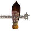 balishine This lamp is produced in Indonesia made from coconut and mahogany wood lampshade from skin of cow with a string of pineapple leaf for decoration.