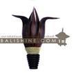 balishine This wall-fitting is produced in Indonesia made from coconut and mahogany wood with a string of pineapple leaf for decoration.